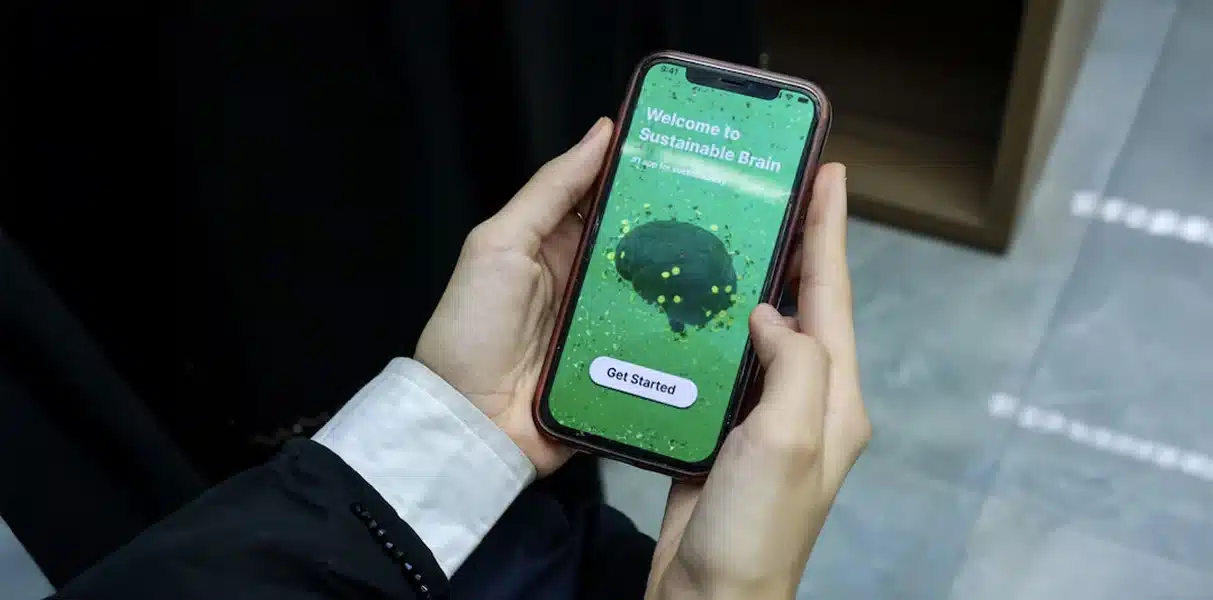 Abu Dhabi students developing EcoMind Academy app, Ghayathi Common School Earth Prize winners, EcoMind Academy app interface promoting recycling education, Students presenting their eco-friendly education app